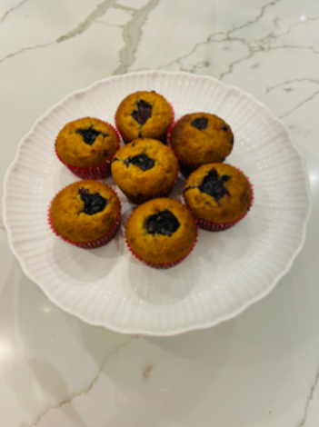 Freshly baked blueberry muffins on a tray